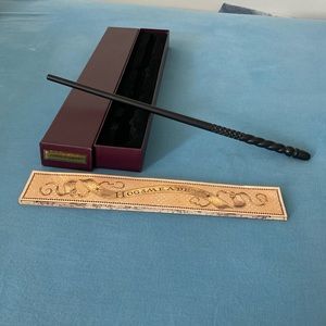 “The Wizarding World of Harry Potter” Harry Potter wand and map.